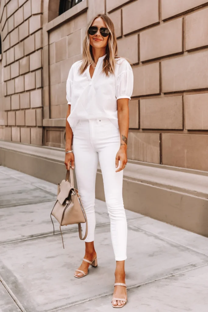 Fashion Jackson Wearing Everlane White Top Everlane White Skinny Jeans Tan Sandals Celine Belt Bag 1