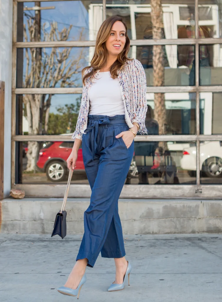 Sydne Style shows how to wear the cropped jeans trend for spring in paperbag waist trousers